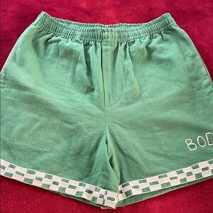 Green rugby inspired checkered trim Shorts from Bode NY